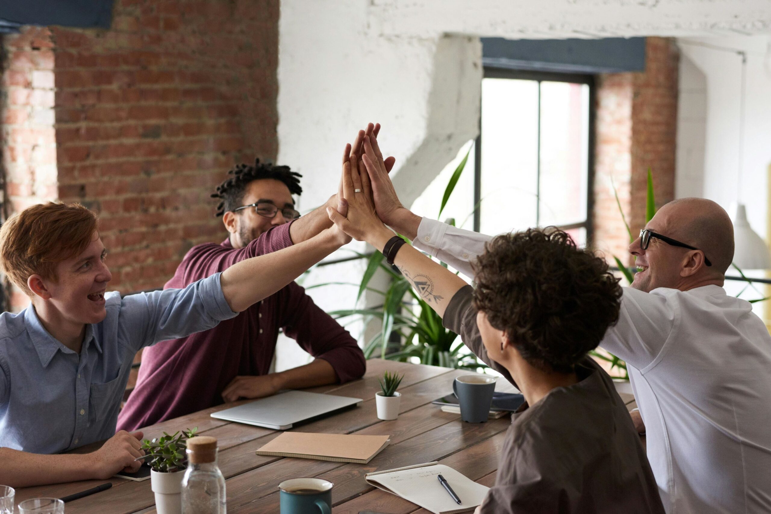 pexels-fauxels-3184422 high fives (smaller) employee benefits