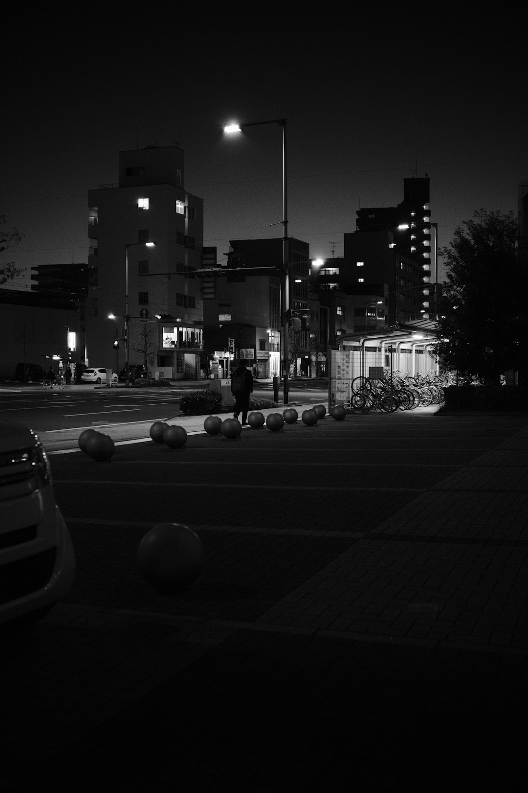 Photo by Mak a black and white photo of a city street at night